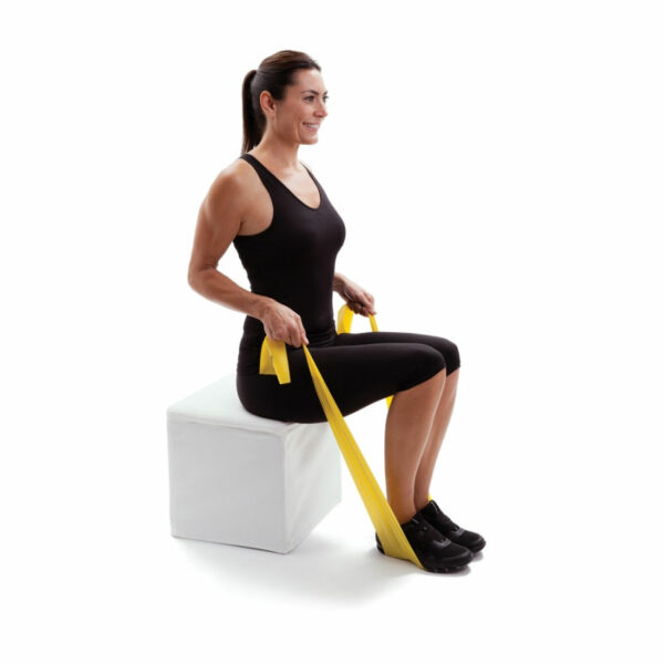 woman sitting on exercise block with yellow exercise bands stretched from under feet to hands