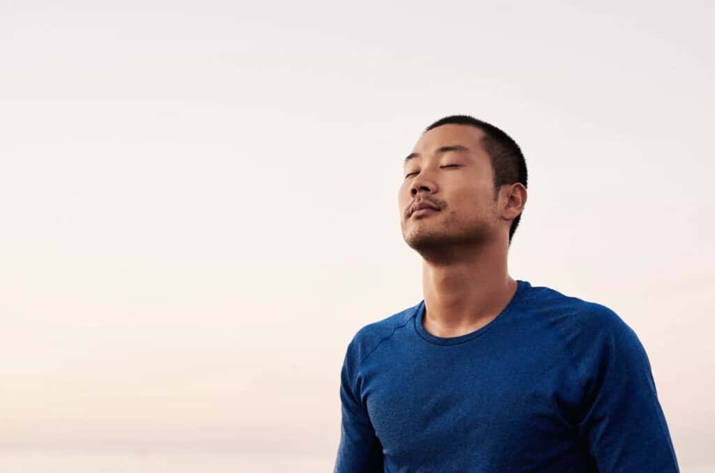 Man breathing meditating