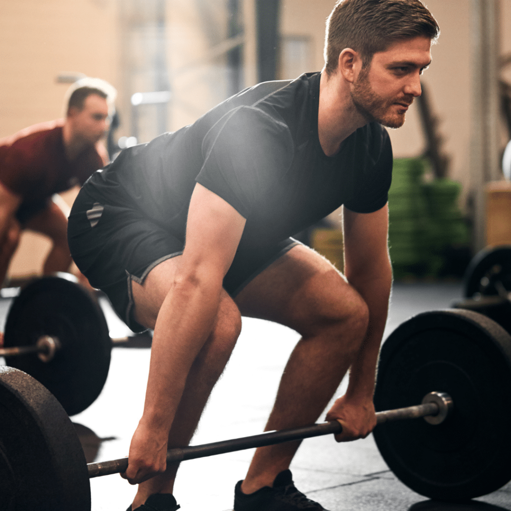 man lifting weights